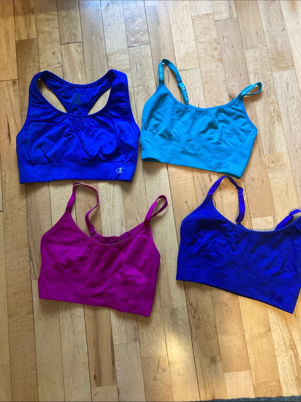 Bundle of 3 under Armour sports bras and 1 champion med